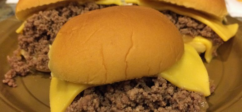 Loose meat hamburger topped with cheese