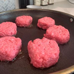 Cooking Burgers/sliders on a pan indoors