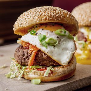 Burger with a Fried Egg on Top on a sesame seed bun