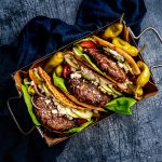 Tray of Burgers in a Pita with bright veggies