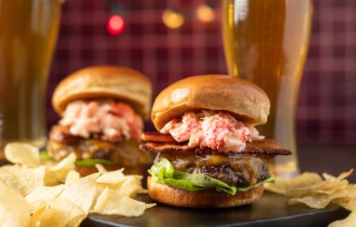 Burgers topped with lobster and bacon