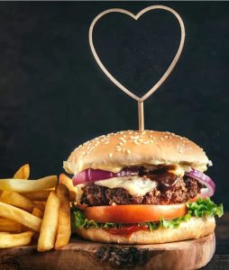 Header Image of Burger and fries with heart-shaped tooth pick