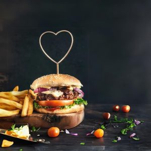 Header image of burger and fries with heart-shaped tooth pick