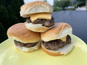 One burger slider stacked on top of two sliders