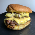A double-stacked Smashburger with melted American cheese.