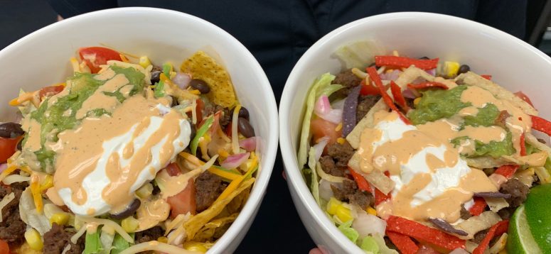 taco bowls with ground beef, chips, tomatos, lettuce and more