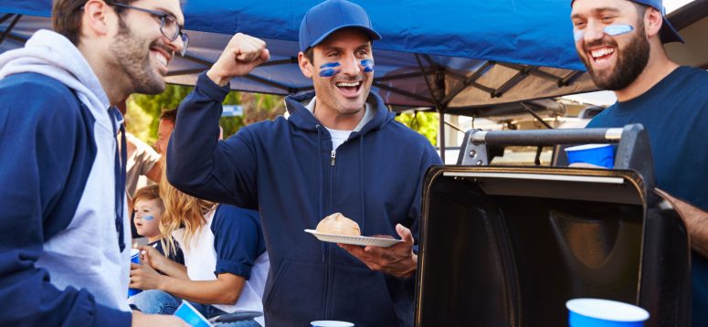 tailgate with friends around the grill during the fall or winter