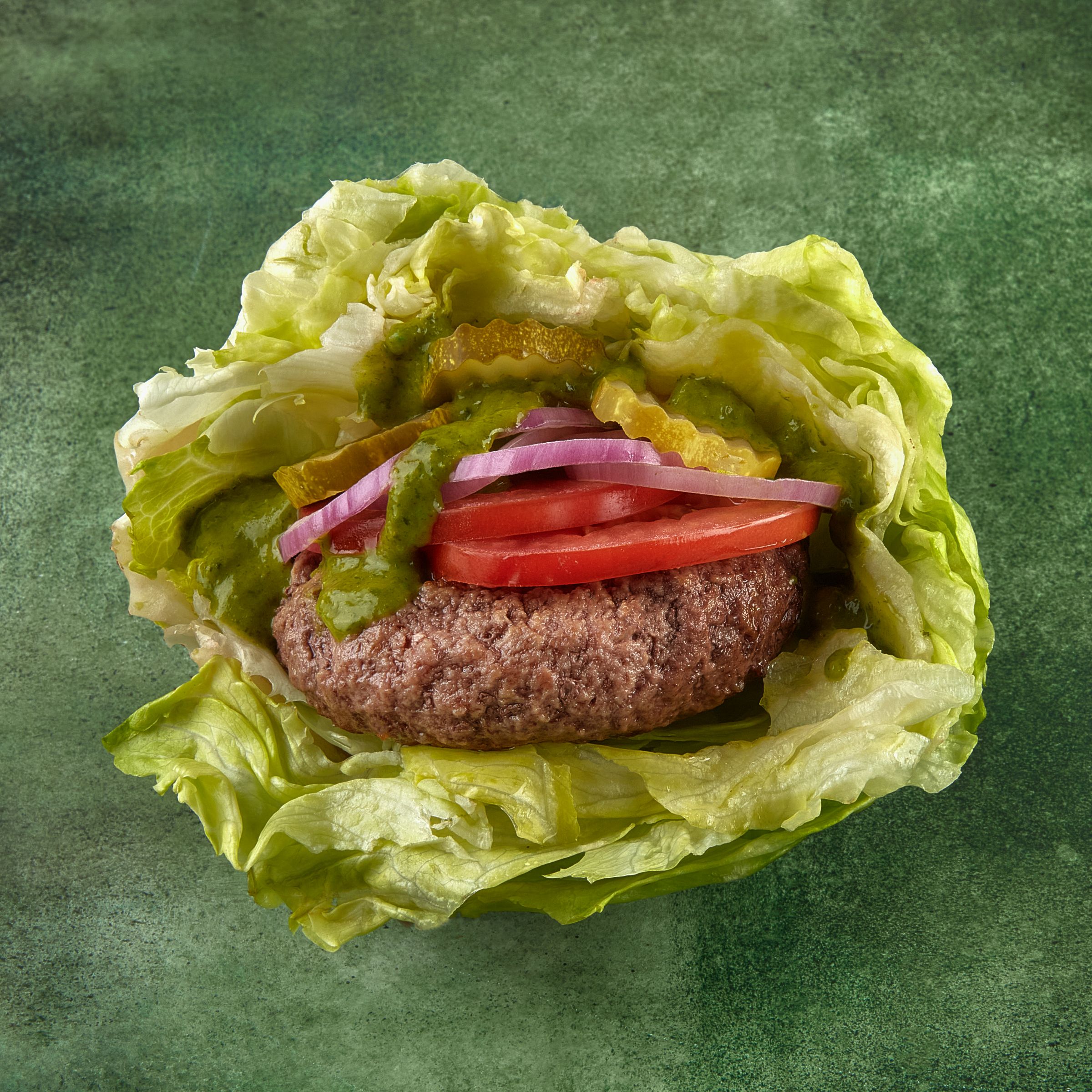 lettuce wrap burger topped with pickes, lettuce, onion and tomatoes. perfect healthy ground beef recipe