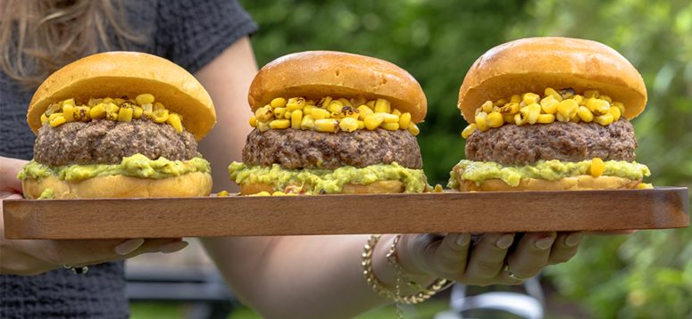 schweid and sons burgers topped with guacamole and corn