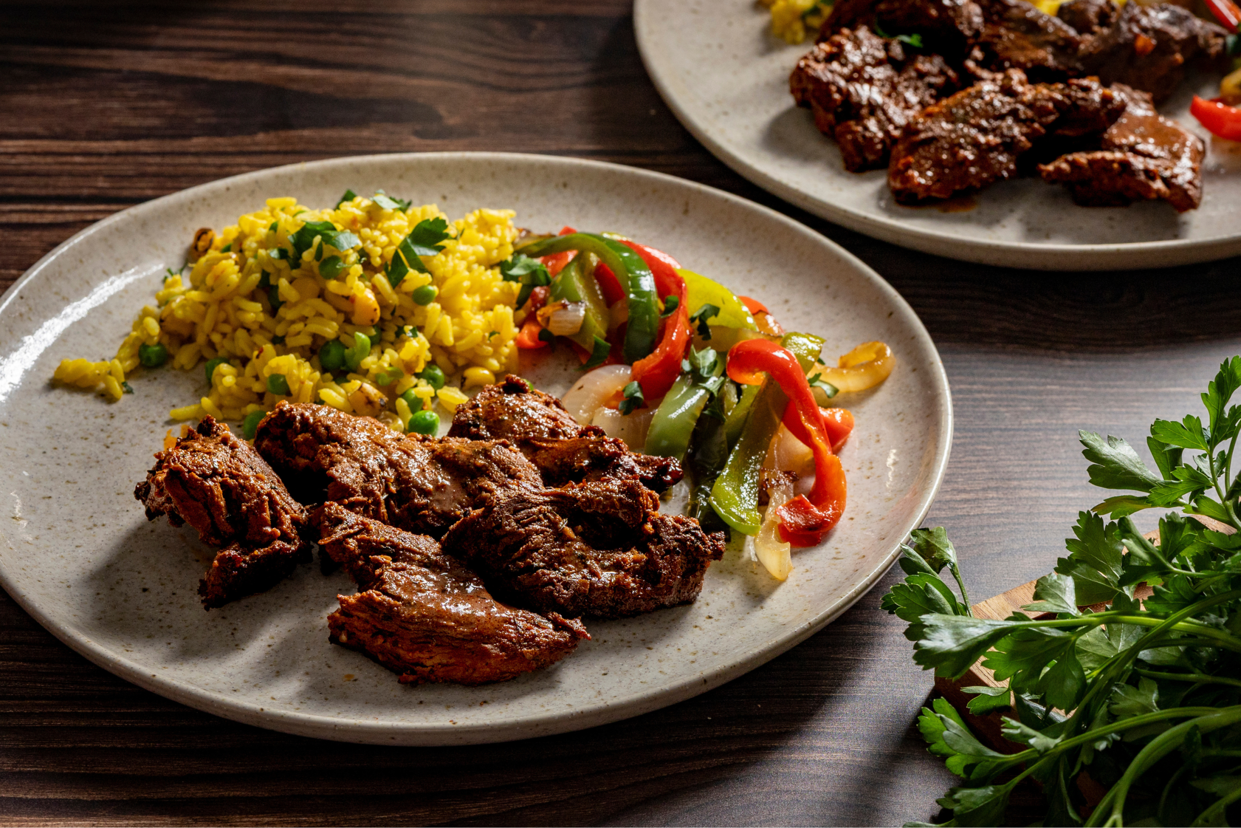 Schweid & Sons cajun-style Tri-Tip Blend marinated steak tups served with rice and roasted peppers
