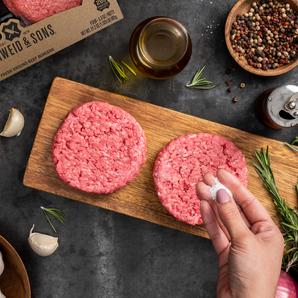 seasoning schweid and sons burgers with salt and pepper