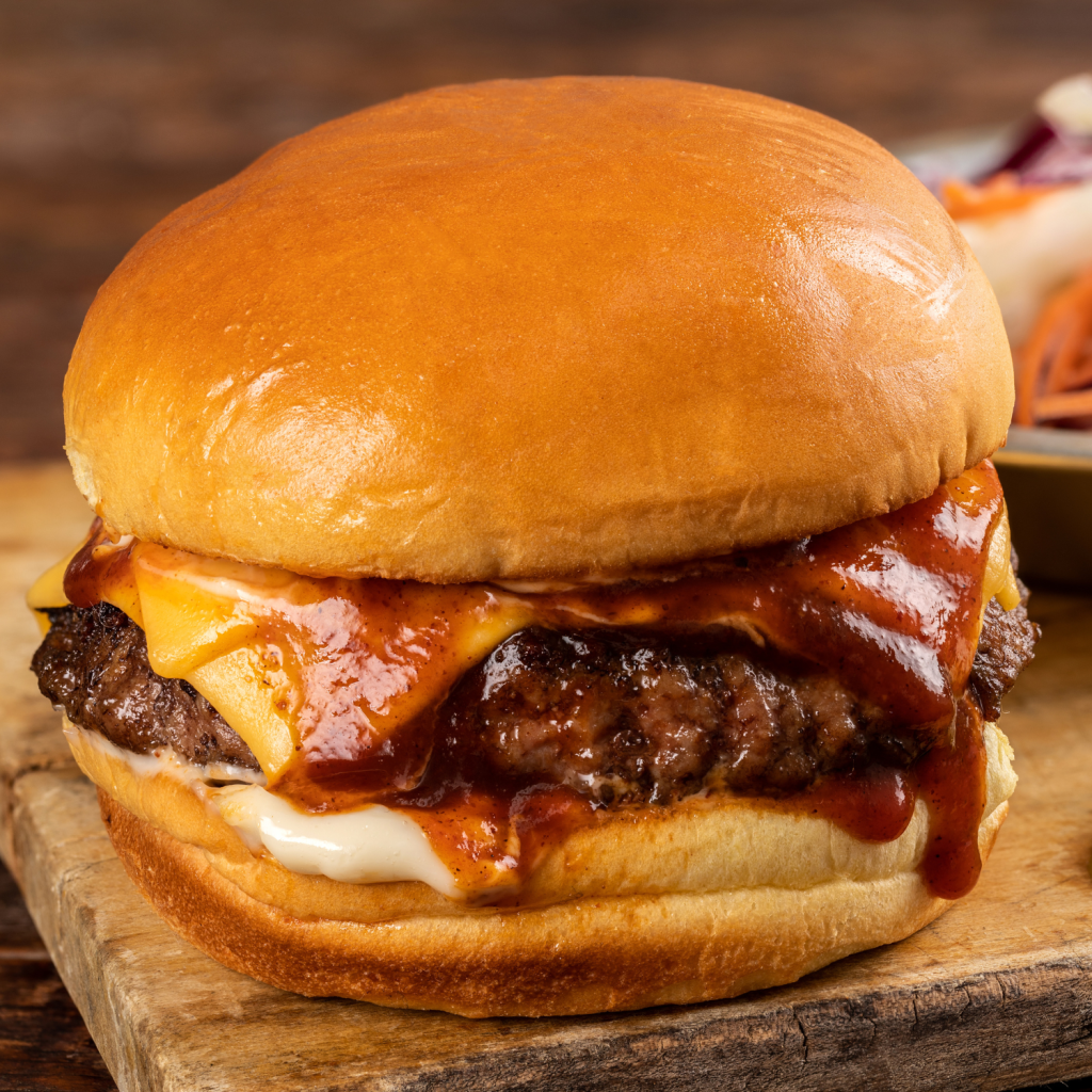 schweid and sons tailgate zinger burger topped with cheese and barbecue sauce